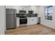 Modern kitchen with stainless steel appliances and white cabinets at 9120 E Girard Ave # 12, Denver, CO 80231