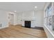 Bright living room with a fireplace and wood floors at 9120 E Girard Ave # 12, Denver, CO 80231