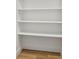 Interior closet with shelving and wood floors at 9120 E Girard Ave # 12, Denver, CO 80231
