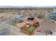 Aerial view of an orange home with solar panels and mountain views in the distance at 2414 Winding Dr, Longmont, CO 80504