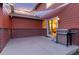Comfortable back patio with a sunshade, barbecue grill, and easy access through sliding glass doors at 2414 Winding Dr, Longmont, CO 80504