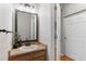 Well-lit bathroom with a decorative mirror and modern fixtures at 2414 Winding Dr, Longmont, CO 80504