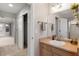 Bathroom featuring a single sink vanity, closet, and shower at 2414 Winding Dr, Longmont, CO 80504