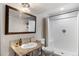 Nicely updated bathroom featuring modern fixtures, and a walk-in tiled shower at 2414 Winding Dr, Longmont, CO 80504