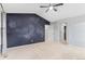 Bedroom featuring a starry feature wall, closet and light carpet at 2414 Winding Dr, Longmont, CO 80504