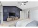 Bedroom featuring a starry feature wall, tv, closet and light carpet at 2414 Winding Dr, Longmont, CO 80504
