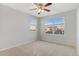 Bright bedroom with neutral carpet, and two large windows at 2414 Winding Dr, Longmont, CO 80504