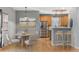 Bright dining area featuring modern table with chairs, with breakfast bar and stainless steel appliances at 2414 Winding Dr, Longmont, CO 80504
