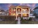 Charming two-story home featuring a welcoming porch and balcony on a landscaped lot at 2414 Winding Dr, Longmont, CO 80504