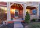 Inviting front porch with brick accents and manicured landscaping at 2414 Winding Dr, Longmont, CO 80504