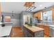 Well-lit kitchen with a stone island, stainless steel appliances, and lots of counter space at 2414 Winding Dr, Longmont, CO 80504