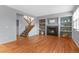 Cozy living room features a fireplace, built-in shelving, and staircase with natural light at 2414 Winding Dr, Longmont, CO 80504