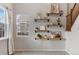 Close up of shelving in a sunlit living room with modern decor at 2414 Winding Dr, Longmont, CO 80504