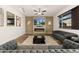 Inviting living room featuring a cozy fireplace, stylish decor, and a comfortable seating arrangement at 25127 E Maple Ave, Aurora, CO 80018