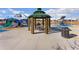 A playground with a gazebo and playground equipment, provides a safe and fun environment for community children at 25127 E Maple Ave, Aurora, CO 80018