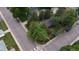 Bird's-eye view of a cozy home with mature trees on a residential corner lot at 1703 W Weaver Ave, Littleton, CO 80120