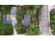 Aerial view of home showing roof, yard and neighborhood surrounded by lush trees at 1703 W Weaver Ave, Littleton, CO 80120