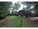 A beautiful, fenced backyard providing ample space, mature trees and a peaceful retreat at 1703 W Weaver Ave, Littleton, CO 80120