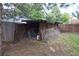 A backyard storage shed with double doors for tools, lawn equipment and extra storage at 1703 W Weaver Ave, Littleton, CO 80120