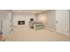 Finished basement featuring a brick fireplace, neutral carpet, and space for recreation and relaxation at 503 Lois Dr, Louisville, CO 80027