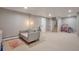 Spacious finished basement featuring neutral tones, plush carpet, and plenty of room for recreation and relaxation at 503 Lois Dr, Louisville, CO 80027