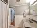 Bathroom featuring wainscoting, neutral walls, a modern vanity and shower-tub combination at 503 Lois Dr, Louisville, CO 80027