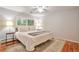 Cozy bedroom featuring a neutral color palette, wood floors, and natural light from the window at 503 Lois Dr, Louisville, CO 80027