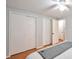 Bedroom with multiple closets, hardwood floors and a ceiling fan at 503 Lois Dr, Louisville, CO 80027