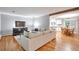 Comfortable living room offers wood floors, neutral colors, and an open layout leading to the kitchen at 503 Lois Dr, Louisville, CO 80027