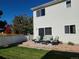 Inviting backyard patio with outdoor seating and green grass at 18902 E 53Rd Ave, Denver, CO 80249