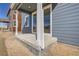 Covered patio with concrete flooring and a view of the backyard at 783 Sunflower Dr, Brighton, CO 80601