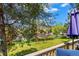 Enjoy the view from the deck of the verdant backyard of this home with mature trees and room to roam at 26351 Sheldon St, Kittredge, CO 80457