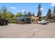 Charming coffee shop with outdoor seating and artistic sunflower mural offering a relaxing spot with curb appeal at 26351 Sheldon St, Kittredge, CO 80457