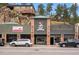 Inviting retail storefront with classic brickwork and clear signage, blending historical charm with modern business appeal at 26351 Sheldon St, Kittredge, CO 80457