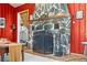 Close-up shot of the impressive stone fireplace in the living room of a cozy home at 26351 Sheldon St, Kittredge, CO 80457