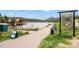 Scenic Evergreen Lake Trail entrance with lush greenery and a clear path leading to recreational activities by the water at 26351 Sheldon St, Kittredge, CO 80457