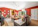 Comfortable living room with bright-colored walls, plush seating, and natural light at 26351 Sheldon St, Kittredge, CO 80457
