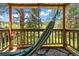 Relax in a hammock on the screened in porch while enjoying the serenity of the green backyard in this quiet setting at 26351 Sheldon St, Kittredge, CO 80457
