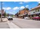 Street view of a lively business district, blending unique shops, mountain views, and a vibrant community atmosphere at 26351 Sheldon St, Kittredge, CO 80457