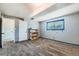 Bright bedroom featuring a window, neutral carpet, and a closet for storage with a grey and blue color scheme at 15373 Uravan St, Brighton, CO 80601