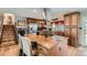 Spacious kitchen features a center island, stainless steel appliances, and ample cabinet storage at 15373 Uravan St, Brighton, CO 80601
