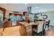 Gourmet kitchen with modern appliances, island with seating, and great lighting at 15373 Uravan St, Brighton, CO 80601