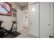 Bedroom featuring a Peloton, closet and entrance to the Primary bathroom at 1488 Madison St # 307, Denver, CO 80206