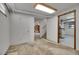 Basement with carpeted floor, stairs, open doorway to finished room at 4095 Field Dr, Wheat Ridge, CO 80033