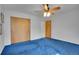 Bedroom features blue carpet flooring and closet storage at 4095 Field Dr, Wheat Ridge, CO 80033