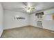 Bedroom with ceiling fan, window, and carpeted floors at 4095 Field Dr, Wheat Ridge, CO 80033