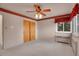 Comfortable bedroom with patterned border, natural light, and closet at 4095 Field Dr, Wheat Ridge, CO 80033