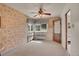 Cozy dining area with wallpaper, vintage lighting fixture, and sunlit windows at 4095 Field Dr, Wheat Ridge, CO 80033