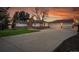 Charming home featuring a three-car garage, brick accents, and a well-manicured lawn, perfect for suburban living at 4095 Field Dr, Wheat Ridge, CO 80033