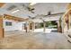 Large garage with two overhead doors opening to the driveway and featuring painted brick accents at 4095 Field Dr, Wheat Ridge, CO 80033